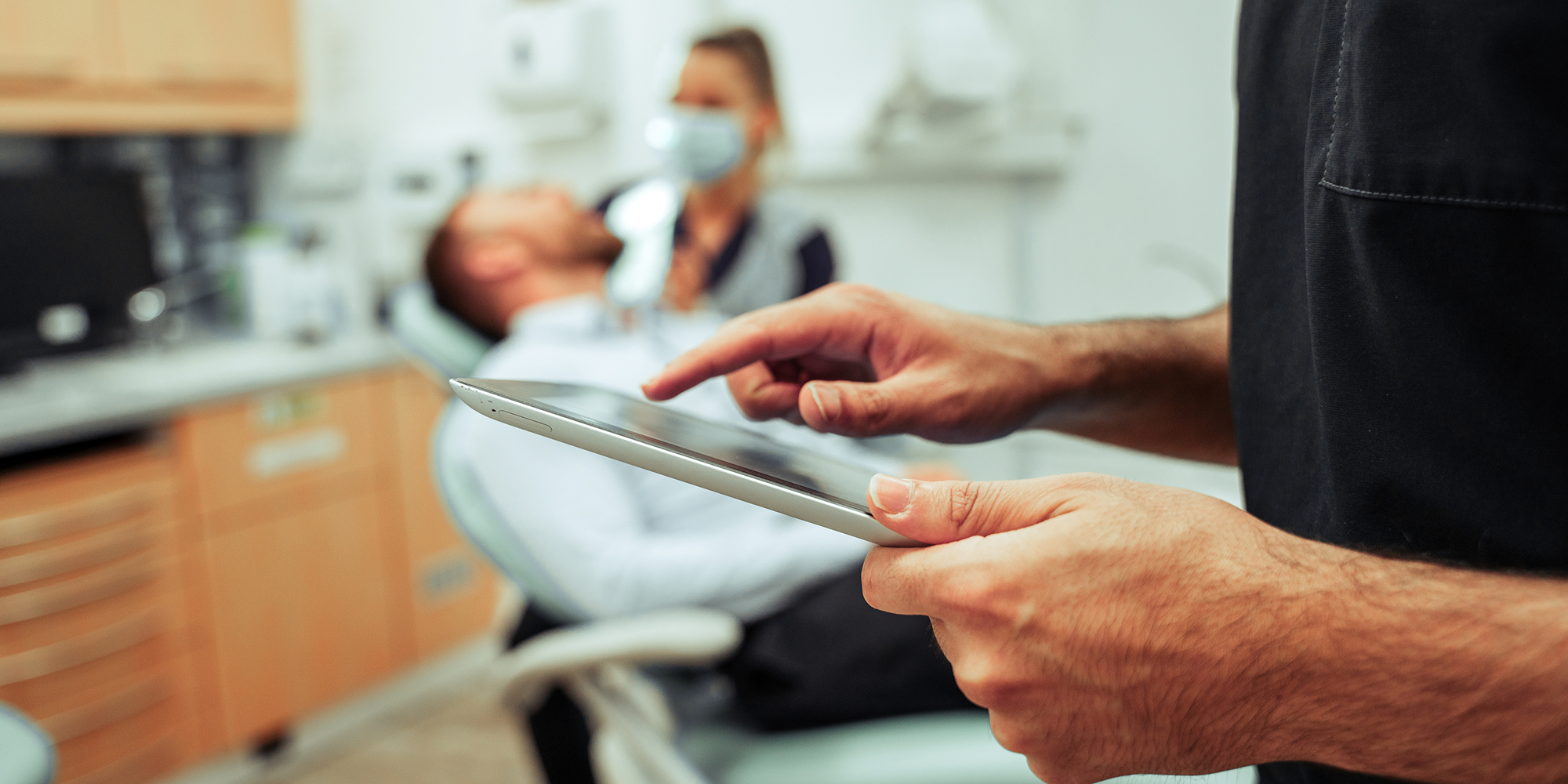 Doctor on ipad checking info