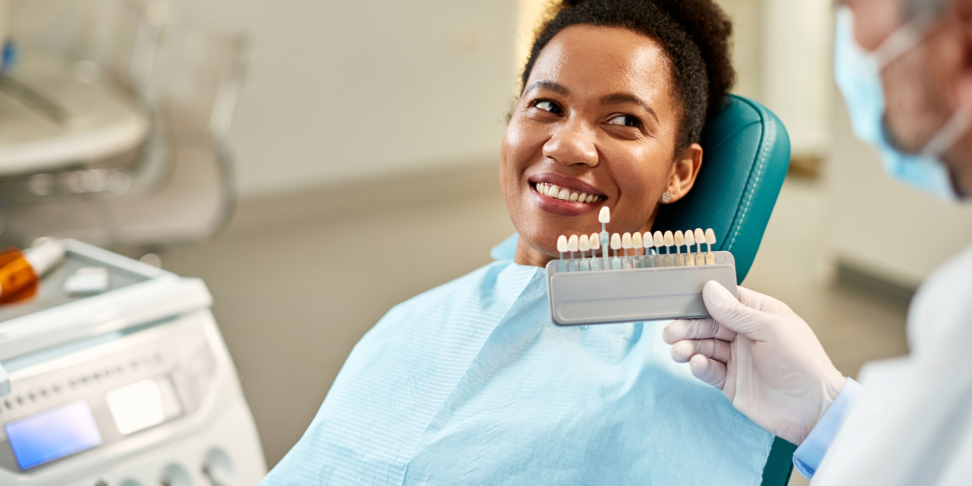 woman smiling at doctor when testing veneers