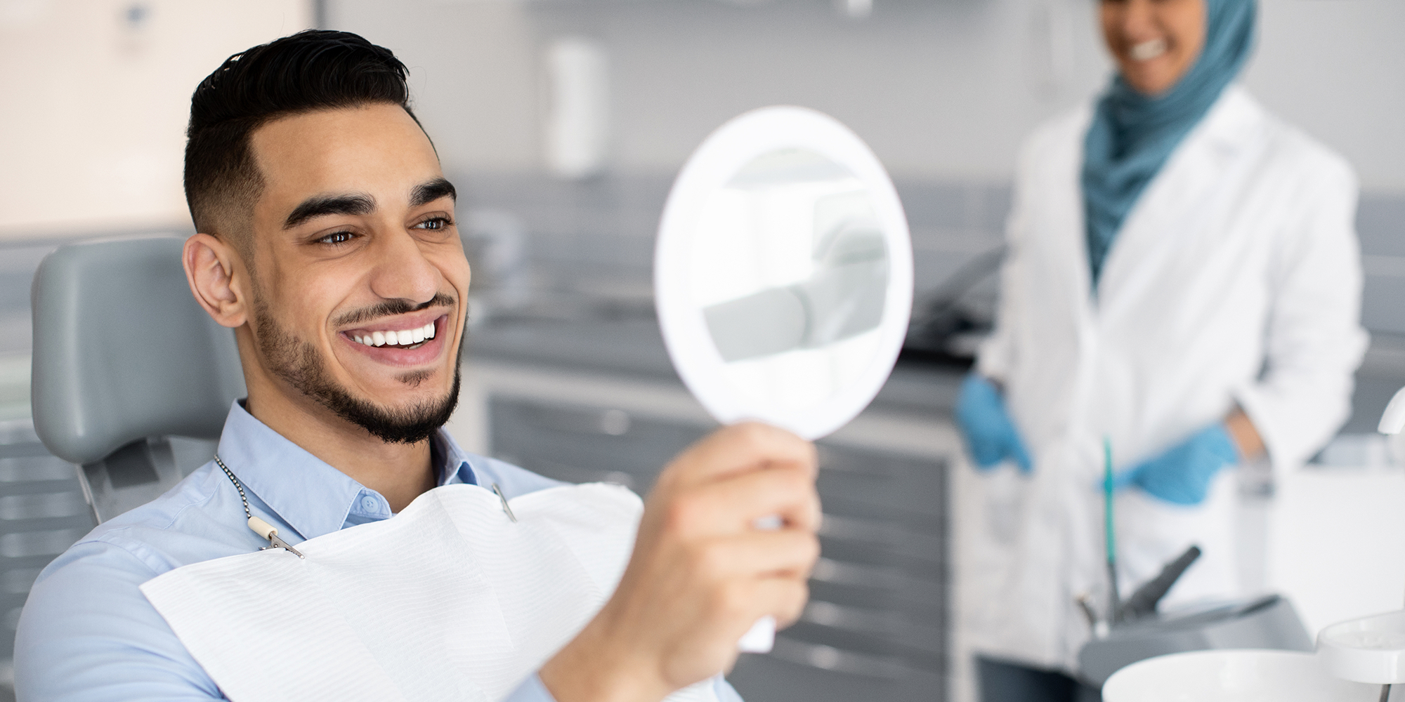 young man looking into mirror