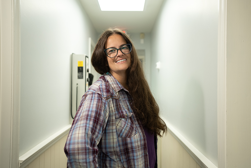 female patient smiling in the hallway of the office