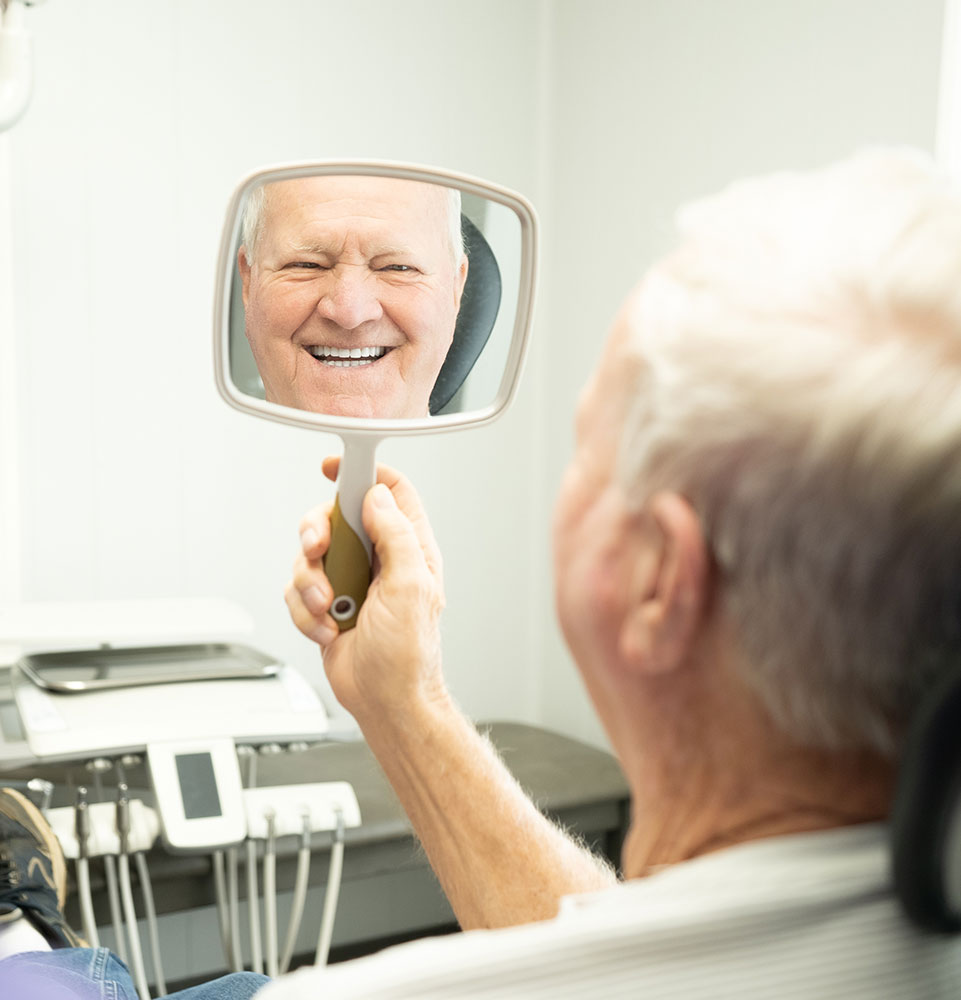 Patient enjoying a smile reveal at McMinn Dental Center