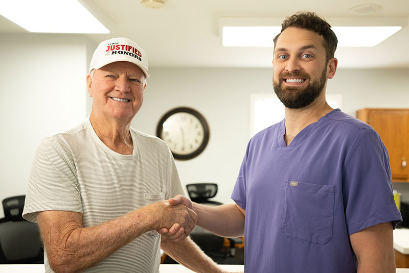 doctor with man in hat