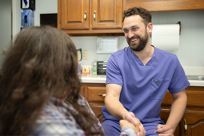 Dr. Connor discussing personalized dental care with a patient