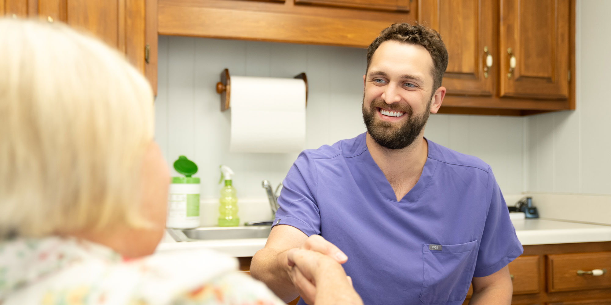 doctor shakes patients hand hero