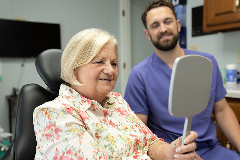 lady with smile reveal dental implants