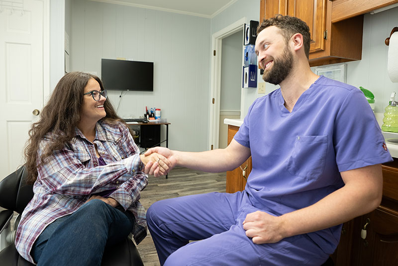lady talks to dr about dental plan